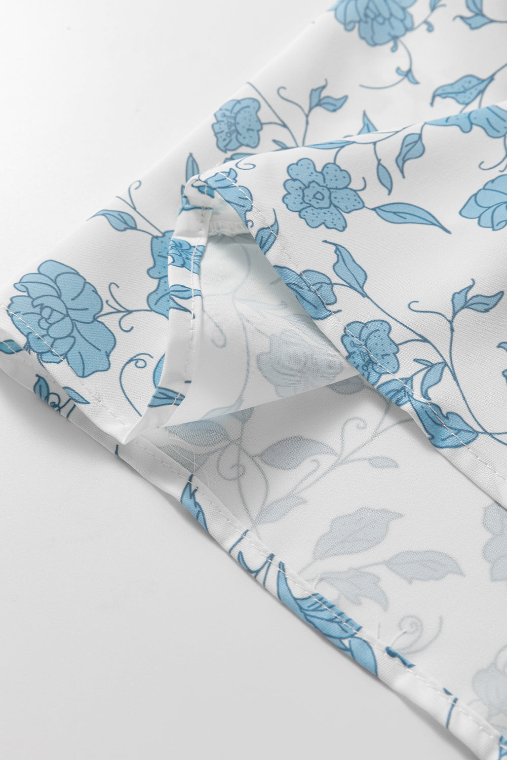 Sky blue floral contrast bow puff sleeve mini dress by Modern Grace, featuring a fitted silhouette and elegant design.