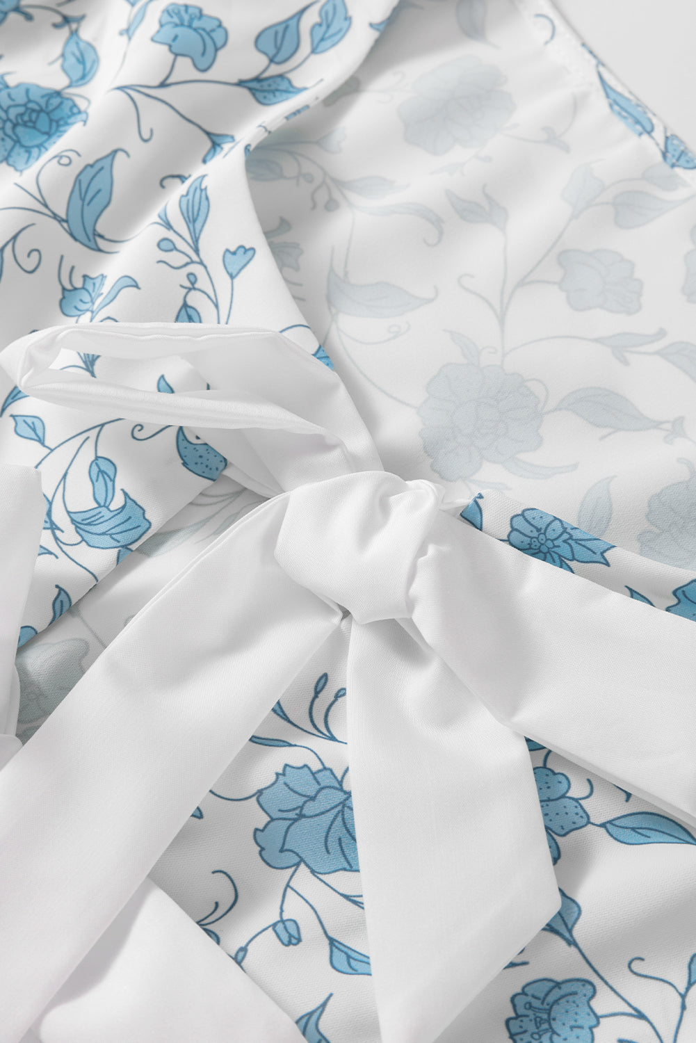 Sky blue floral contrast bow puff sleeve mini dress by Modern Grace featuring a fitted silhouette and feminine design.