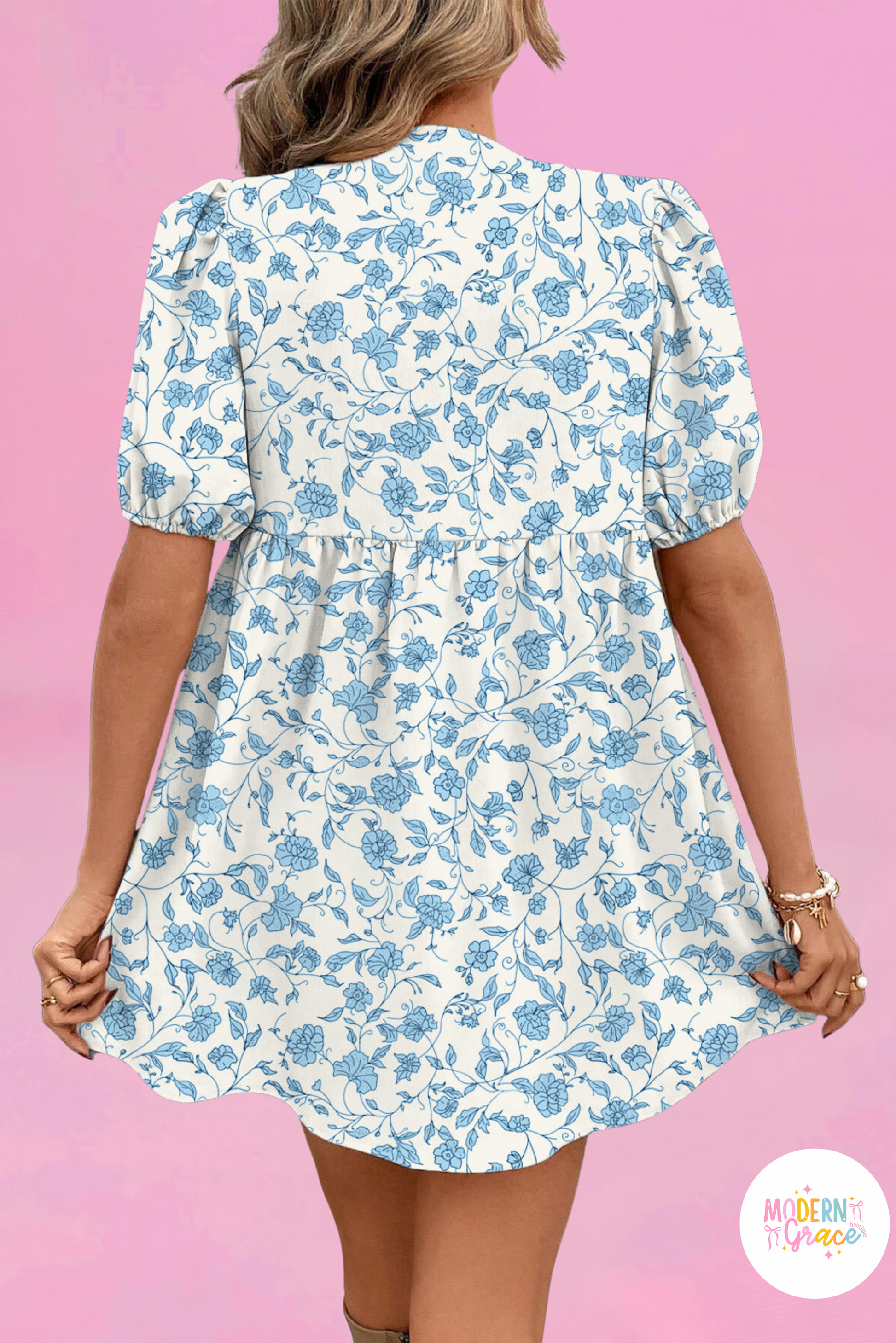 Sky blue floral contrast bow puff sleeve mini dress by Modern Grace, featuring a fitted silhouette and delicate floral pattern.