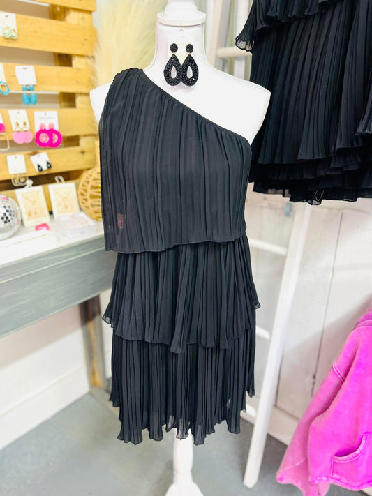 Black layered patchwork hem dress with slanted shoulder design by Modern Grace, featuring a solid color and stylish layered details.