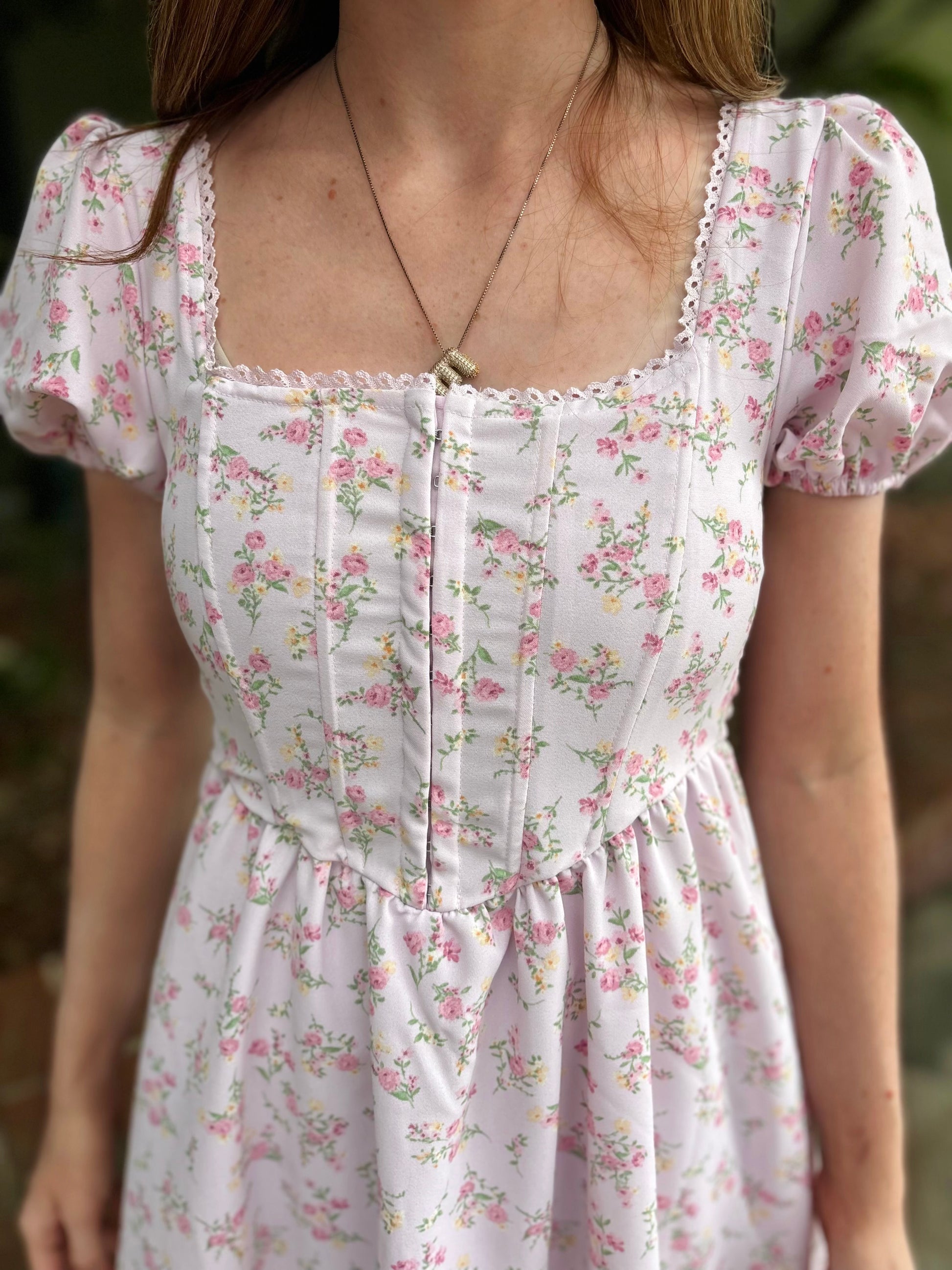 Modern Grace floral lace trim front hook and eye dress showing intricate lace detail and elegant design.