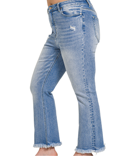 Modern Grace curvy high-rise straight-leg cropped denim pants with raw hem, showcasing stylish fit and classic denim texture.