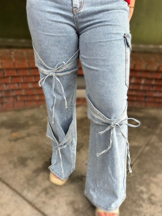 Modern Grace bowknot decor boyfriend cargo jeans featuring relaxed fit, multiple pockets, and stylish design on denim.