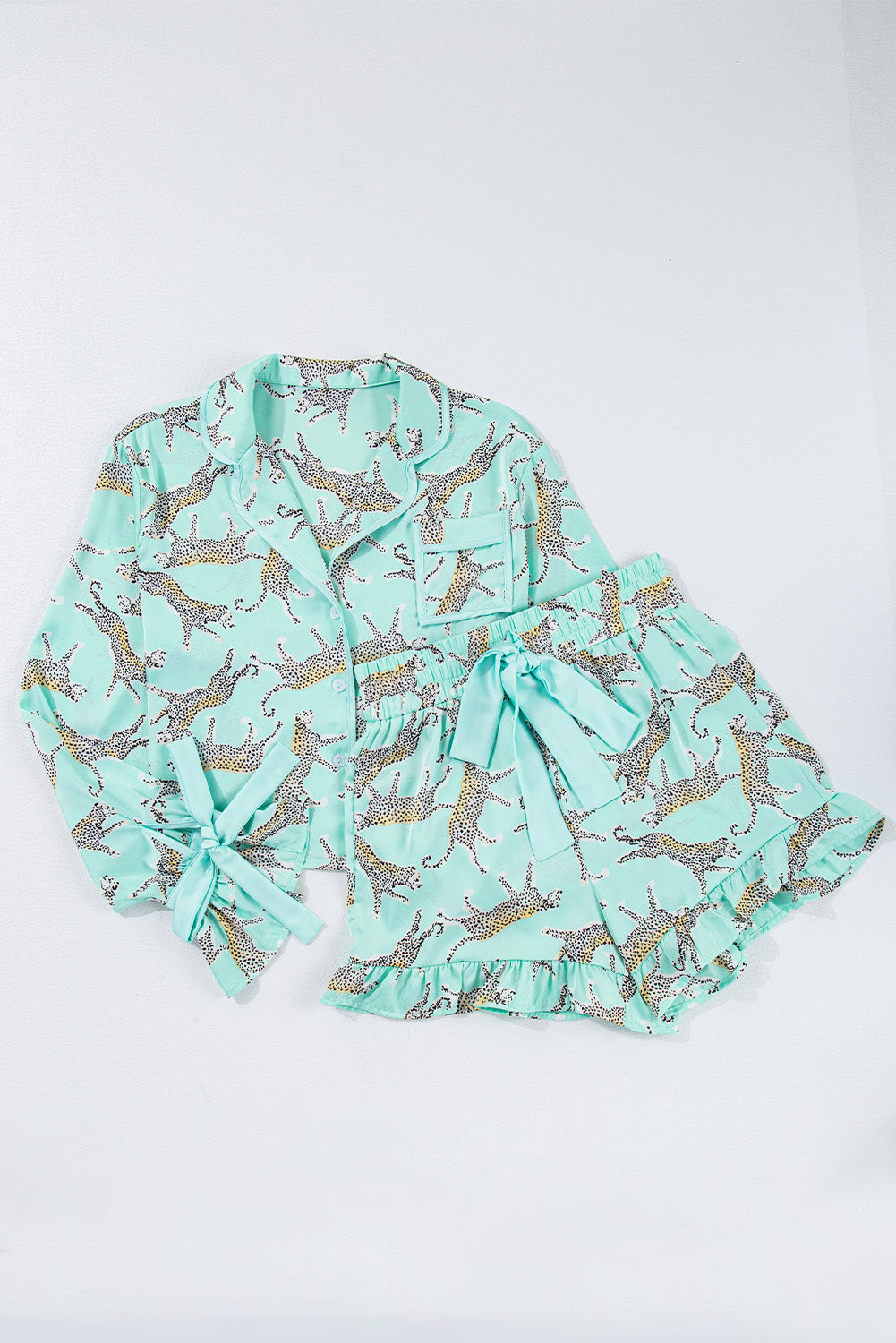 Green leopard satin ruffle pajama short set by Modern Grace, stylish loungewear with ruffled details and comfortable fit.