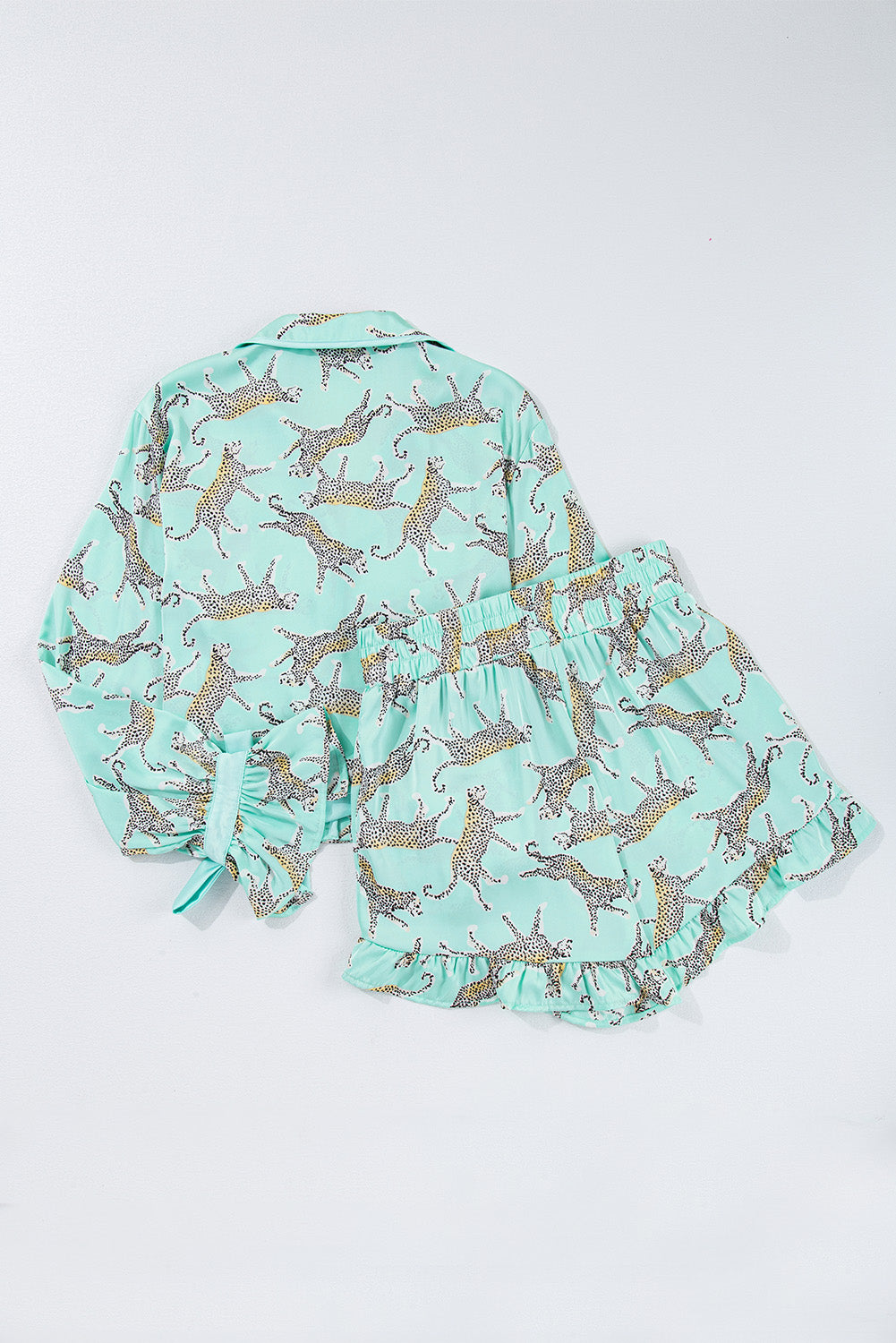 Modern Grace green leopard satin ruffle pajama short set, stylish loungewear with ruffle details, made of polyester and elastane.