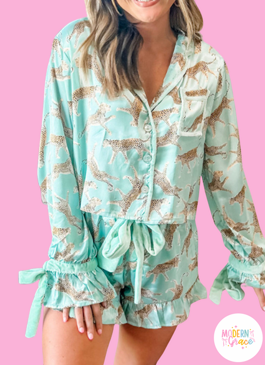 Green leopard satin ruffle pajama short set by Modern Grace, featuring a soft satin fabric and playful ruffle details.