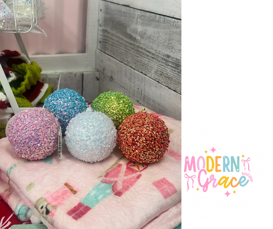 Clear crystal ball ornament from Modern Grace, showcasing a smooth, reflective glass sphere perfect for decorative display.