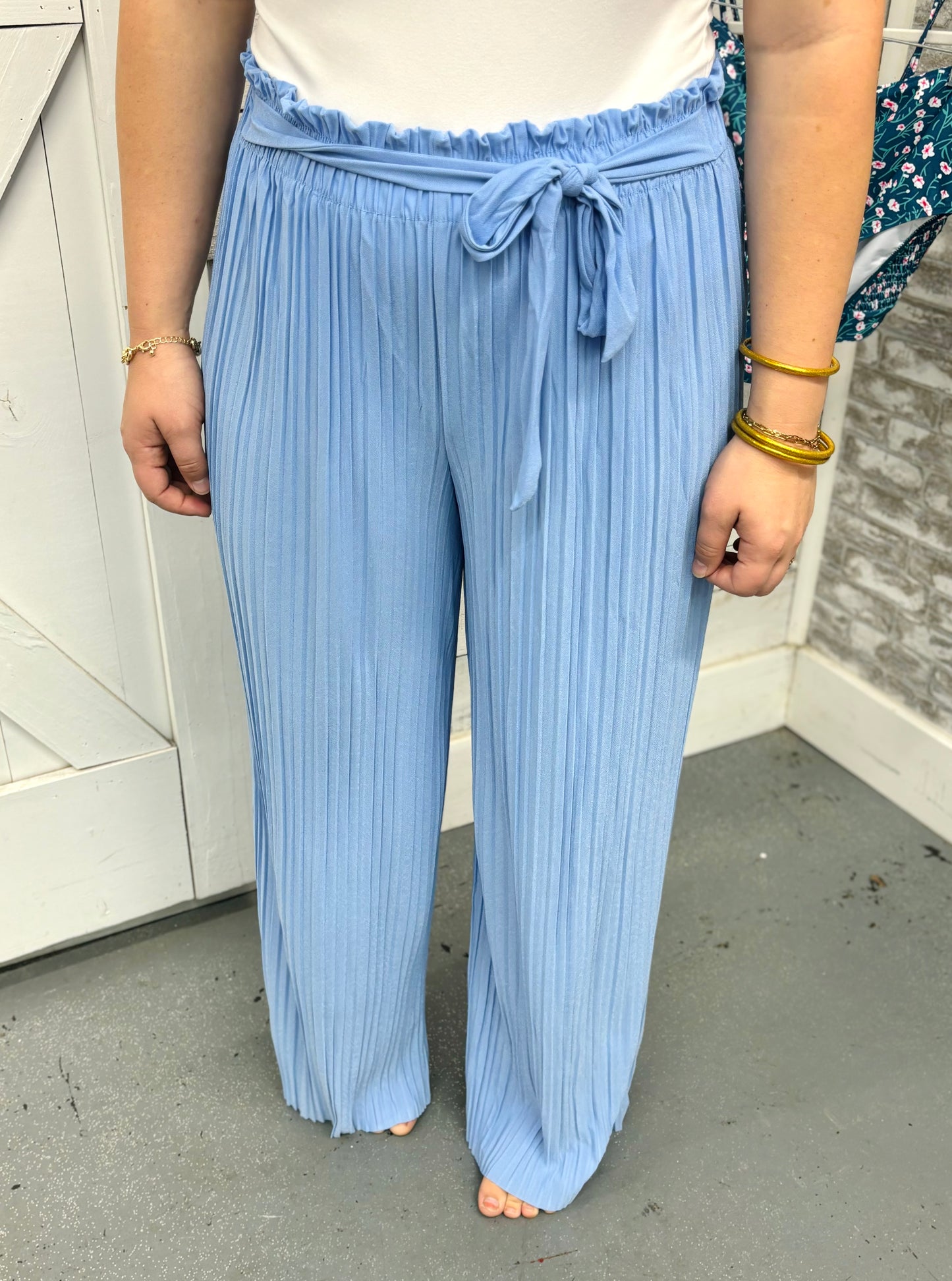 Chambray blue tie-front pleated pants by Modern Grace, showcasing a relaxed fit with front pleats and a stylish tie detail.