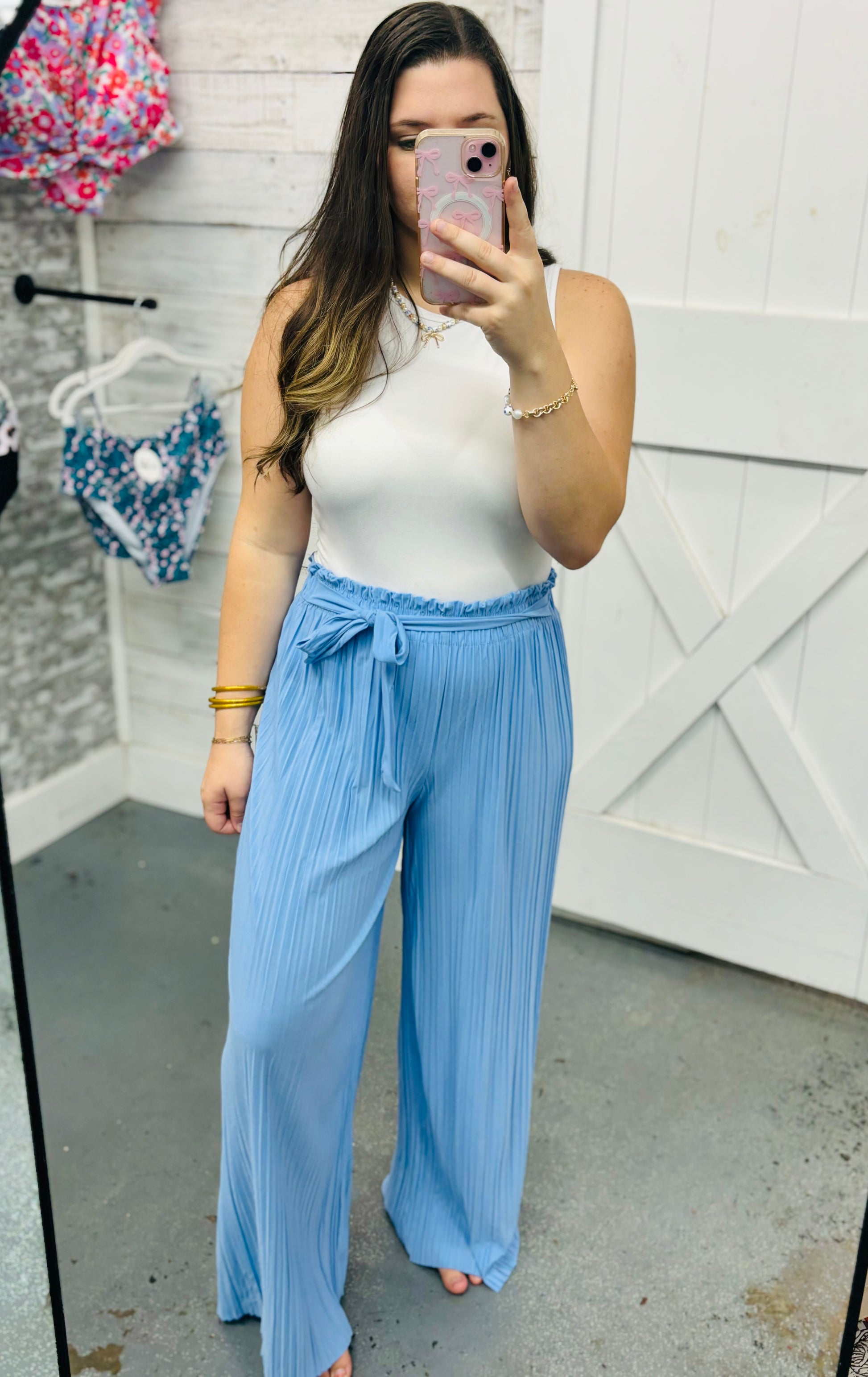 Modern Grace chambray blue tie-front pleated pants with a relaxed fit and stylish design, shown on a model.