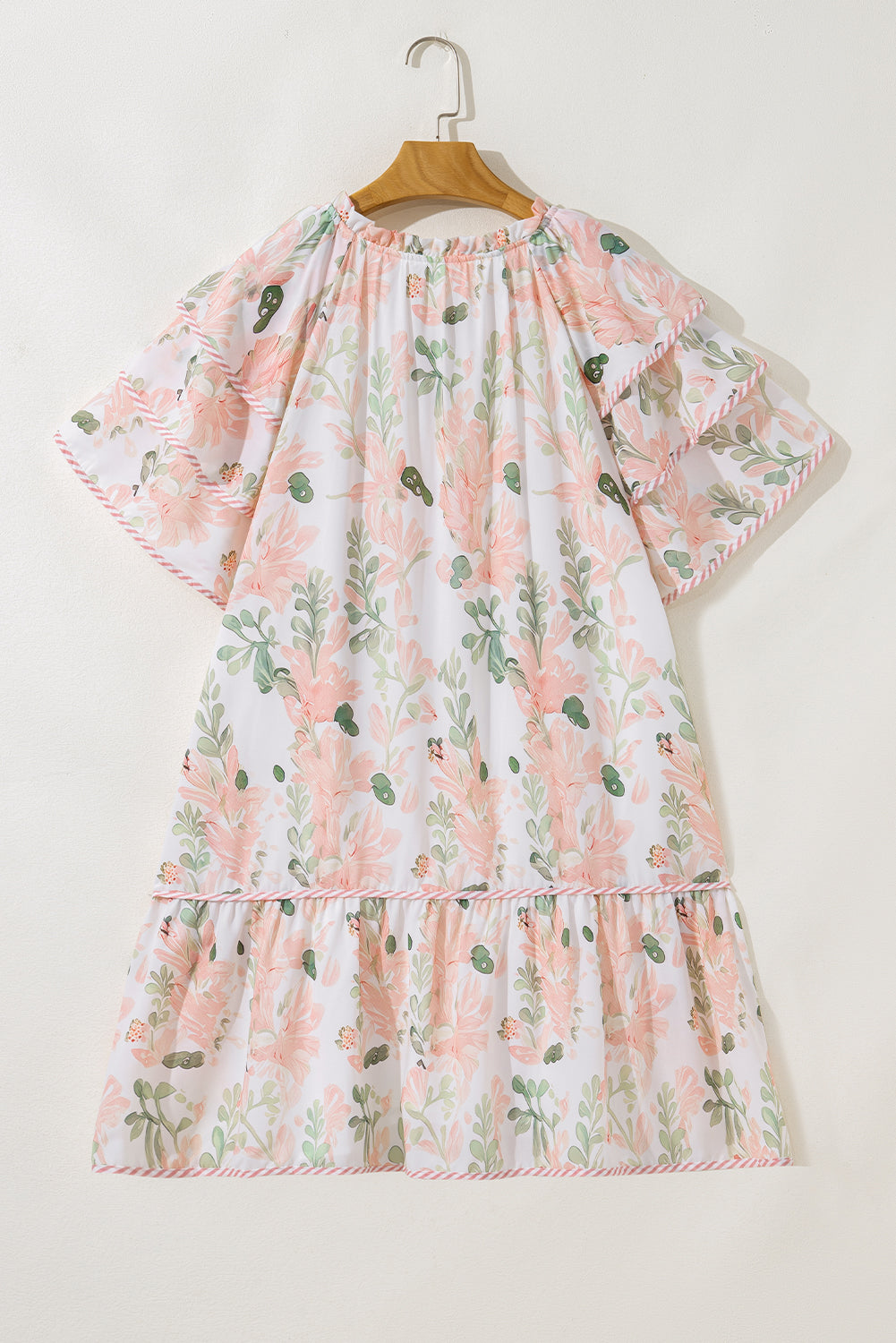 Plus size pink summer dress by Modern Grace featuring floral print and striped details, short length, and a curvy fit.