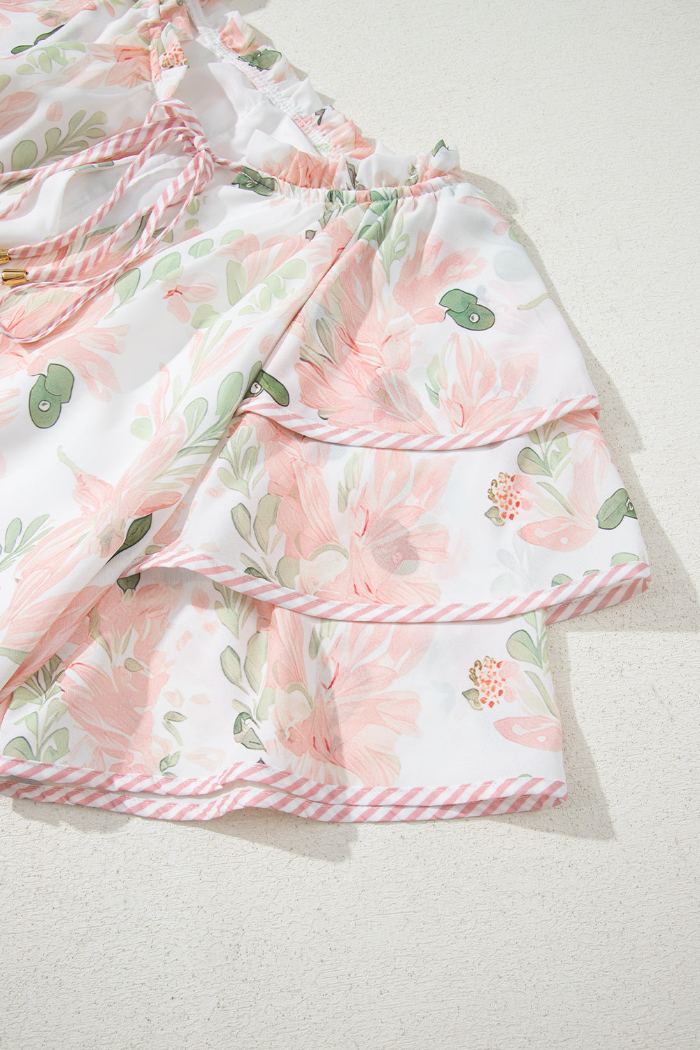 Modern Grace plus size pink summer dress with floral print and striped details, short length, made of lightweight polyester fabric.