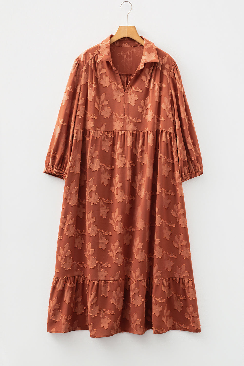 Plus size long dress by Modern Grace featuring textured 3D flower pattern, ruffle hem, and 3/4 sleeves in a maxi style.