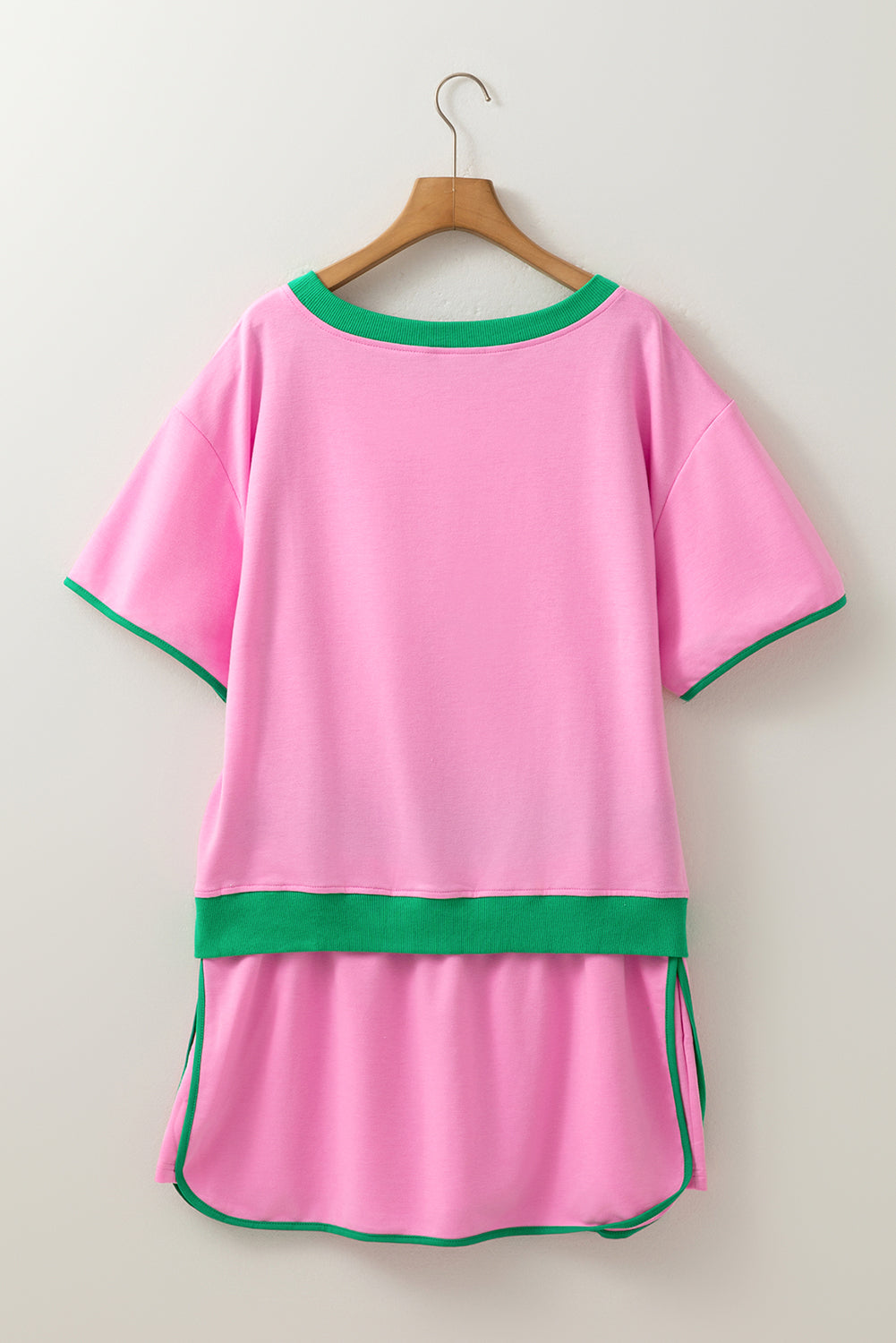 Plus size pink and green two-piece loungewear set with contrast trim from Modern Grace, featuring a T-shirt and skirt.