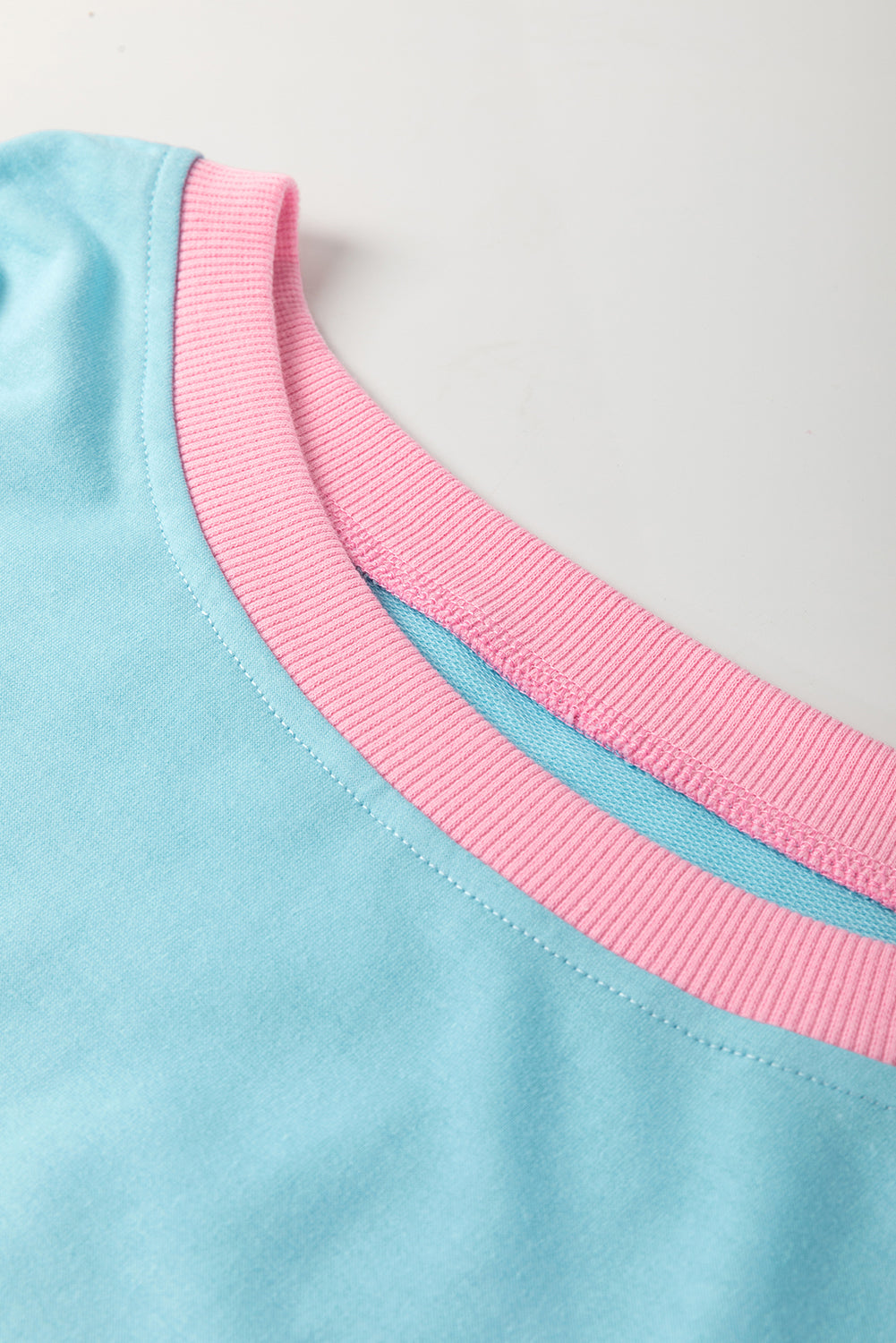 Modern Grace turquoise plus size two-piece loungewear set with contrast trim T-shirt and skirt, made of polyester, cotton, and elastane.
