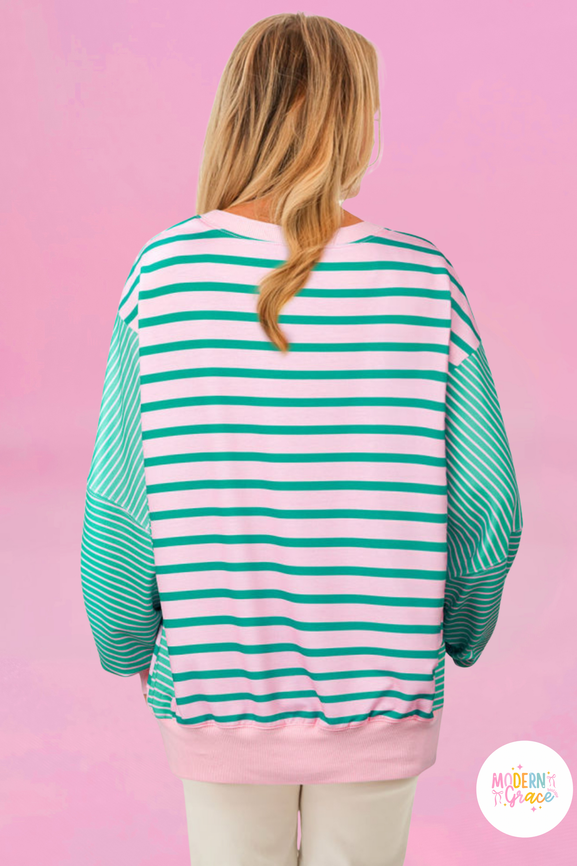 Plus size green stripe color block sweatshirt by Modern Grace with exposed seams and side slit, relaxed fit, warehouse exclusive.