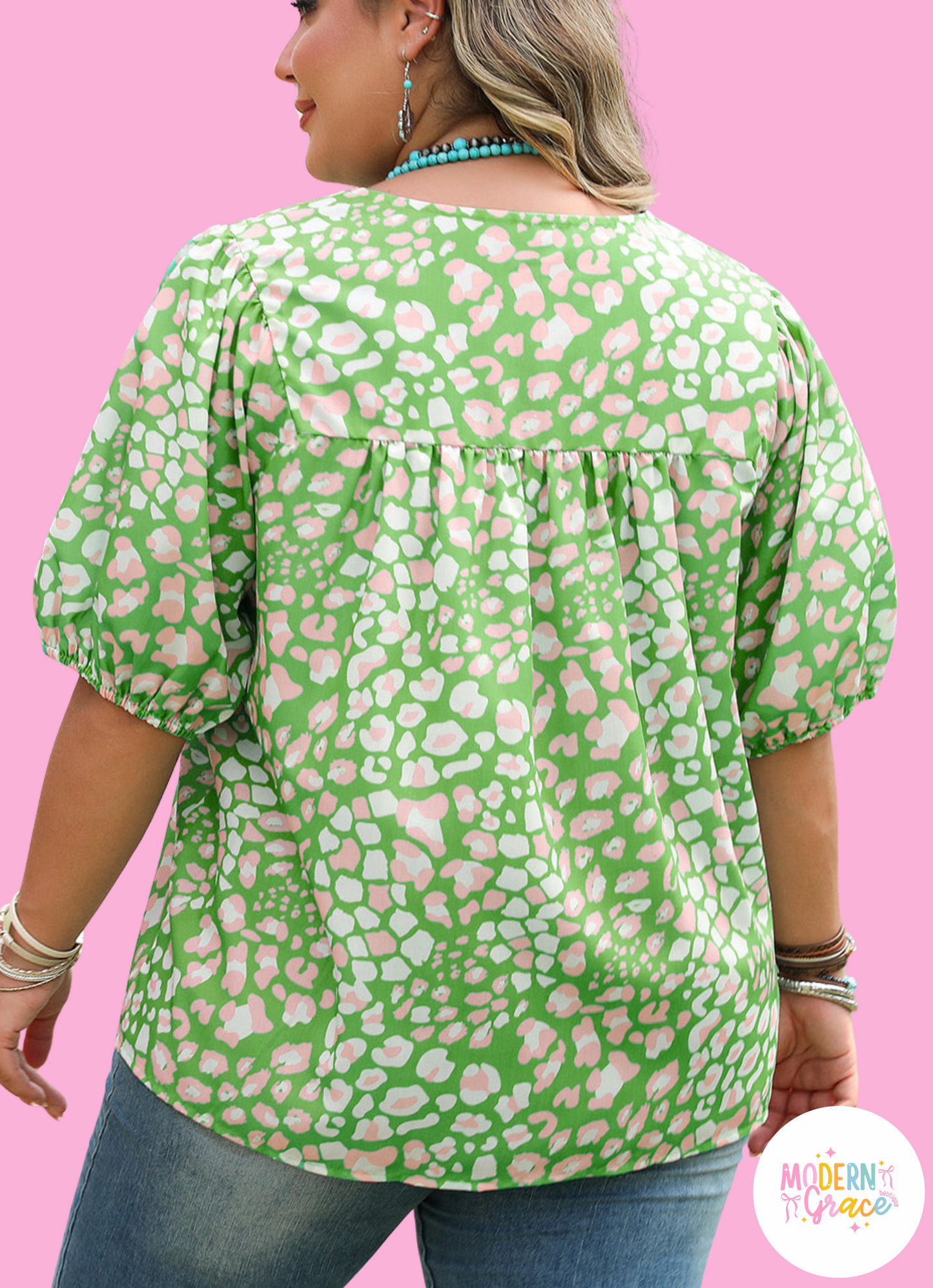 Green plus size floral blouse by Modern Grace with tassel tie, split neck, puff sleeves, and polyester fabric.