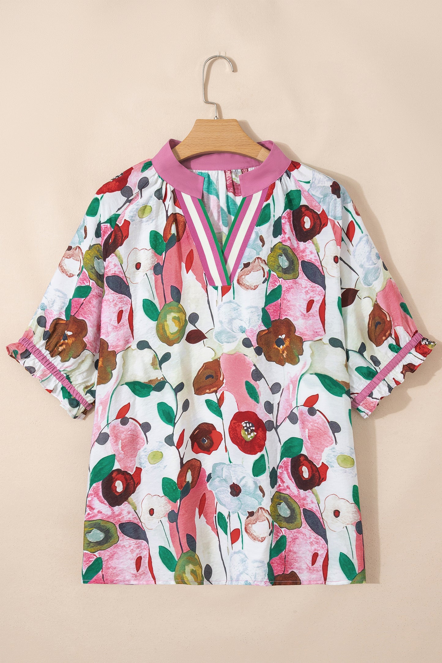 Pink V-neck plus size floral blouse with short puff sleeves from Modern Grace, made of viscose and polyamide fabric.