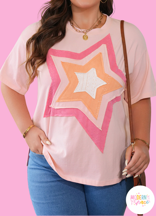 Light pink plus size T-shirt by Modern Grace featuring eyelet lace star applique and a curvy fit, made of cotton and elastane.