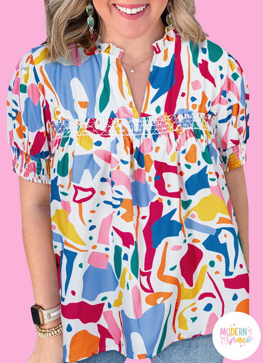 Plus size white abstract print blouse by Modern Grace featuring puff sleeves and shirred cuffs, perfect for stylish plus size tops.