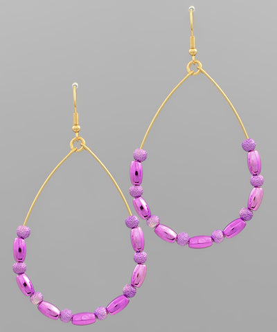 Beaded teardrop earrings by Modern Grace featuring intricate beadwork and elegant teardrop shape for stylish accessories.
