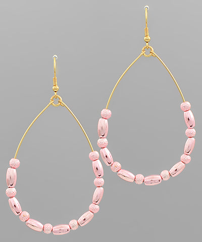 Beaded teardrop earrings by Modern Grace featuring intricate beadwork and elegant teardrop shape for stylish accessories.