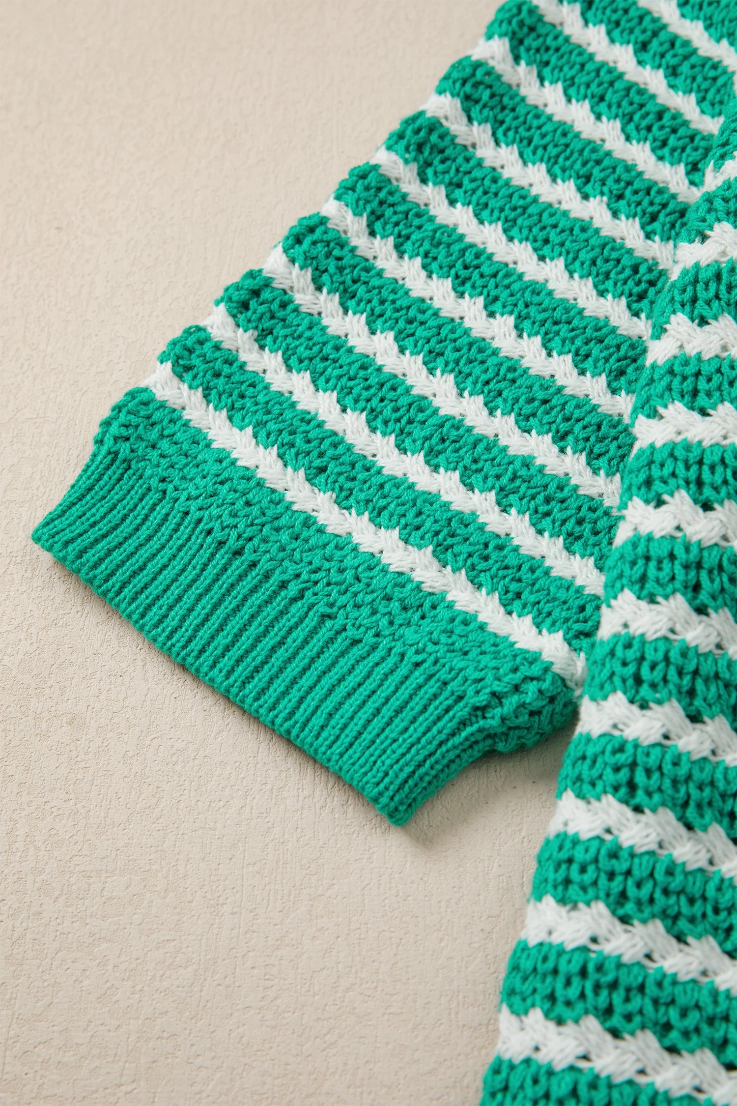 Green stripe short sleeve V-neck sweater with bow knot detail by Modern Grace, showcasing a stylish and casual knit design.