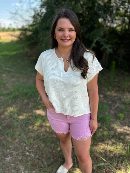 Mauve distressed raw hem shorts by Modern Grace, showing a casual fit and frayed hem detail on lightweight denim fabric.
