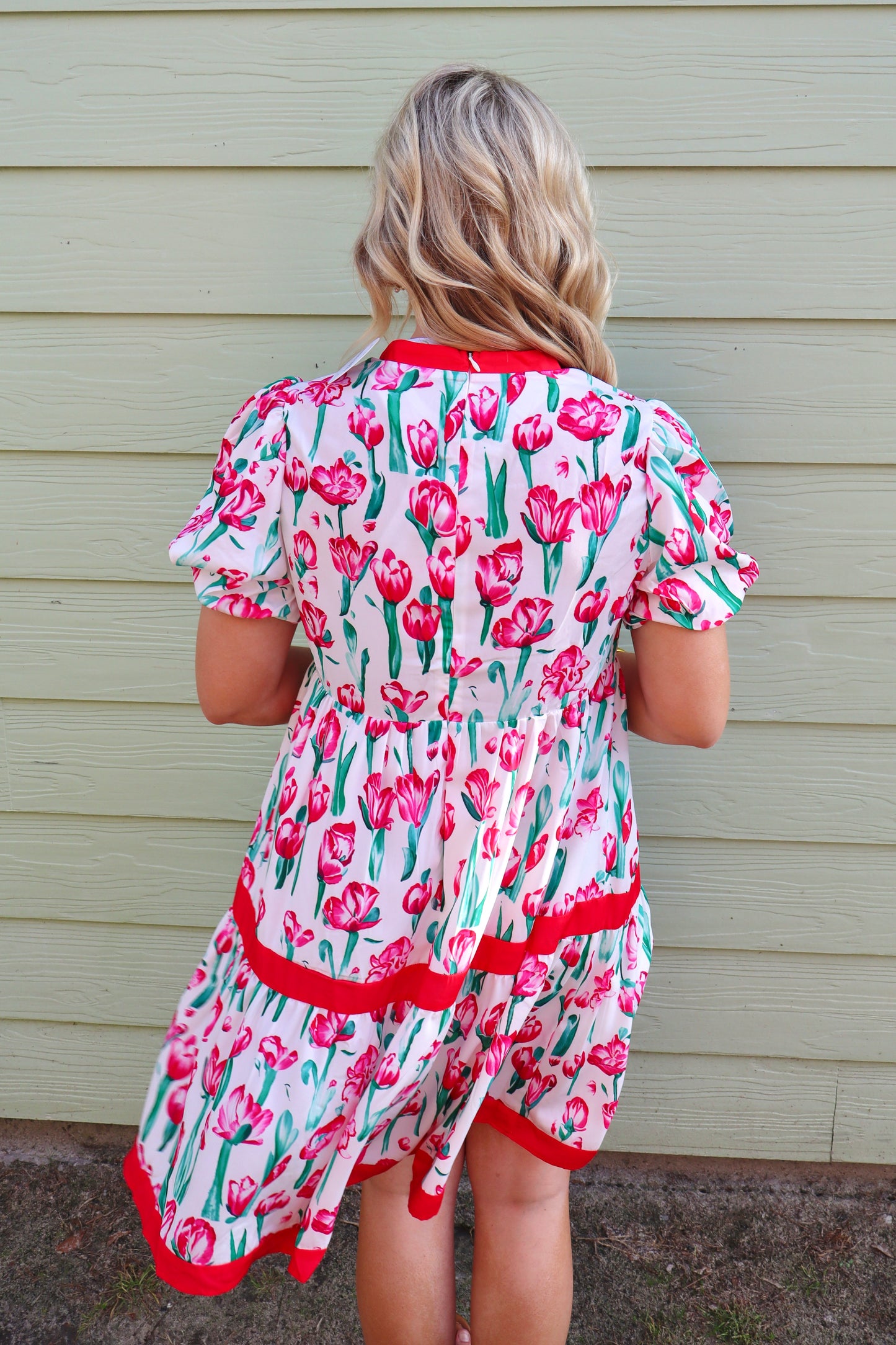 Pink floral print Modern Grace babydoll dress with V-neck, bubble short sleeves, and a relaxed fit, perfect for casual wear.