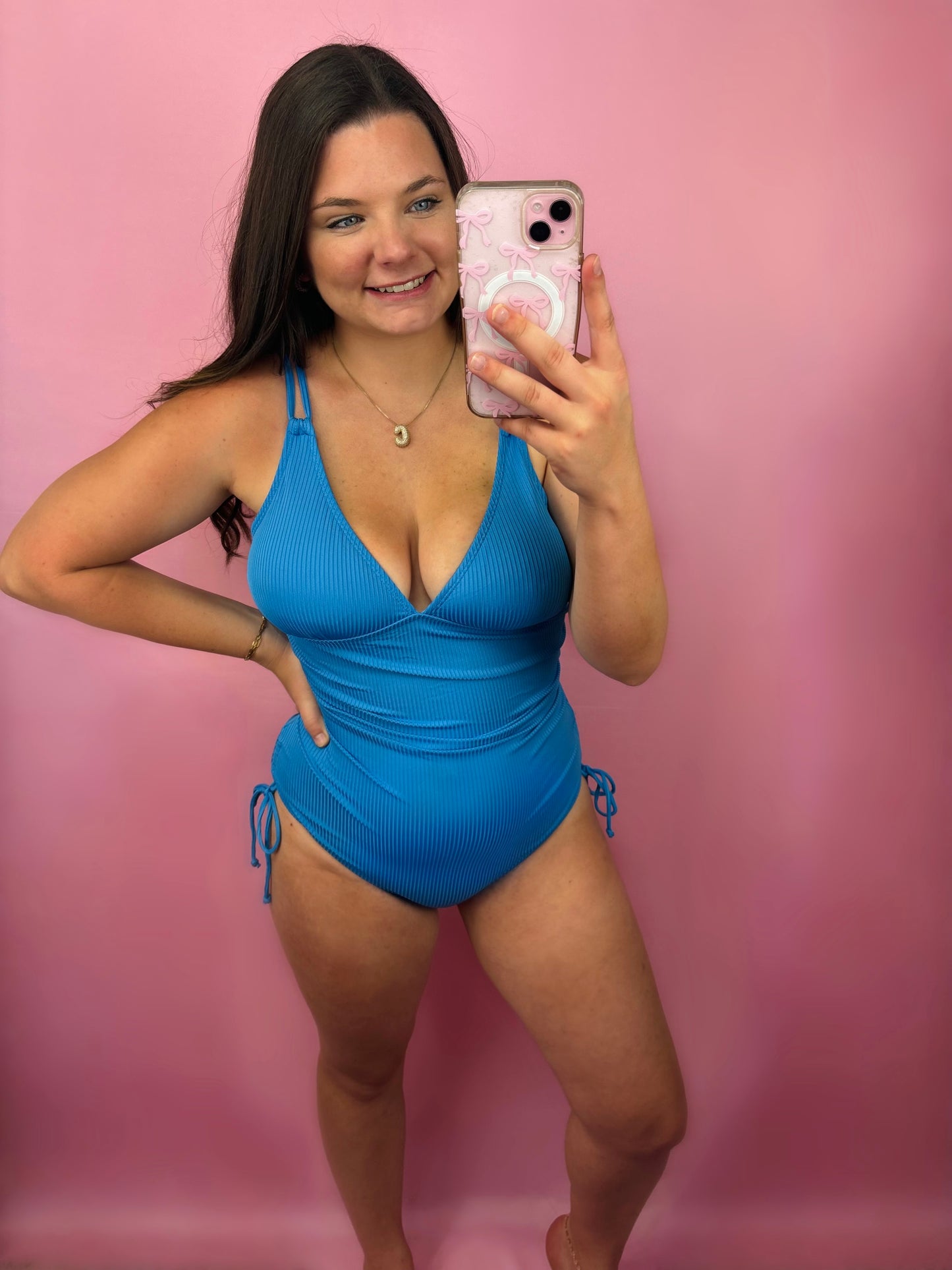 Sky blue ribbed one-piece swimsuit by Modern Grace, featuring a fitted design and scoop neckline, shown on a model.