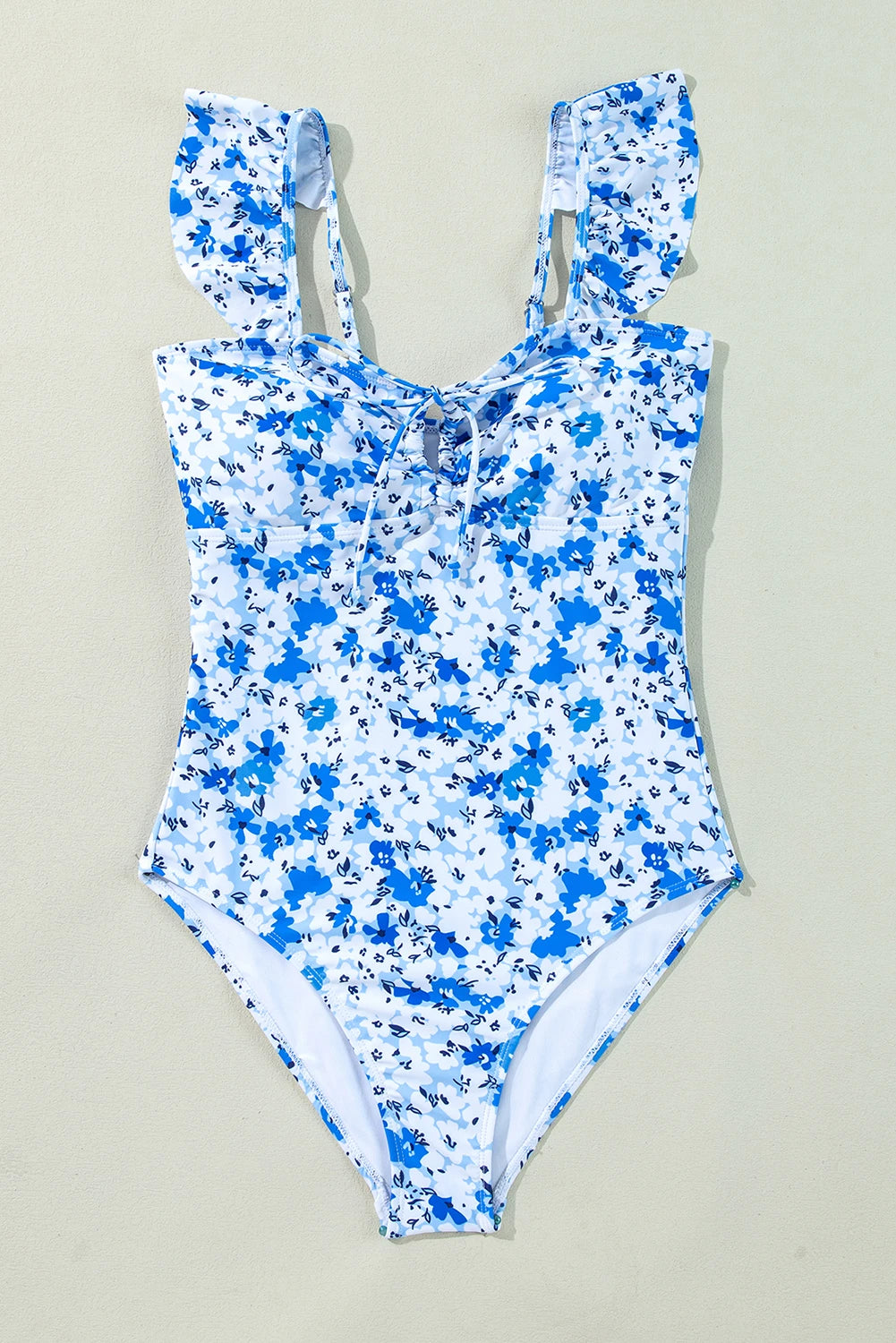 Blue floral lace-up hollow-out one-piece swimsuit by Modern Grace, featuring a stylish design and cut-out details.