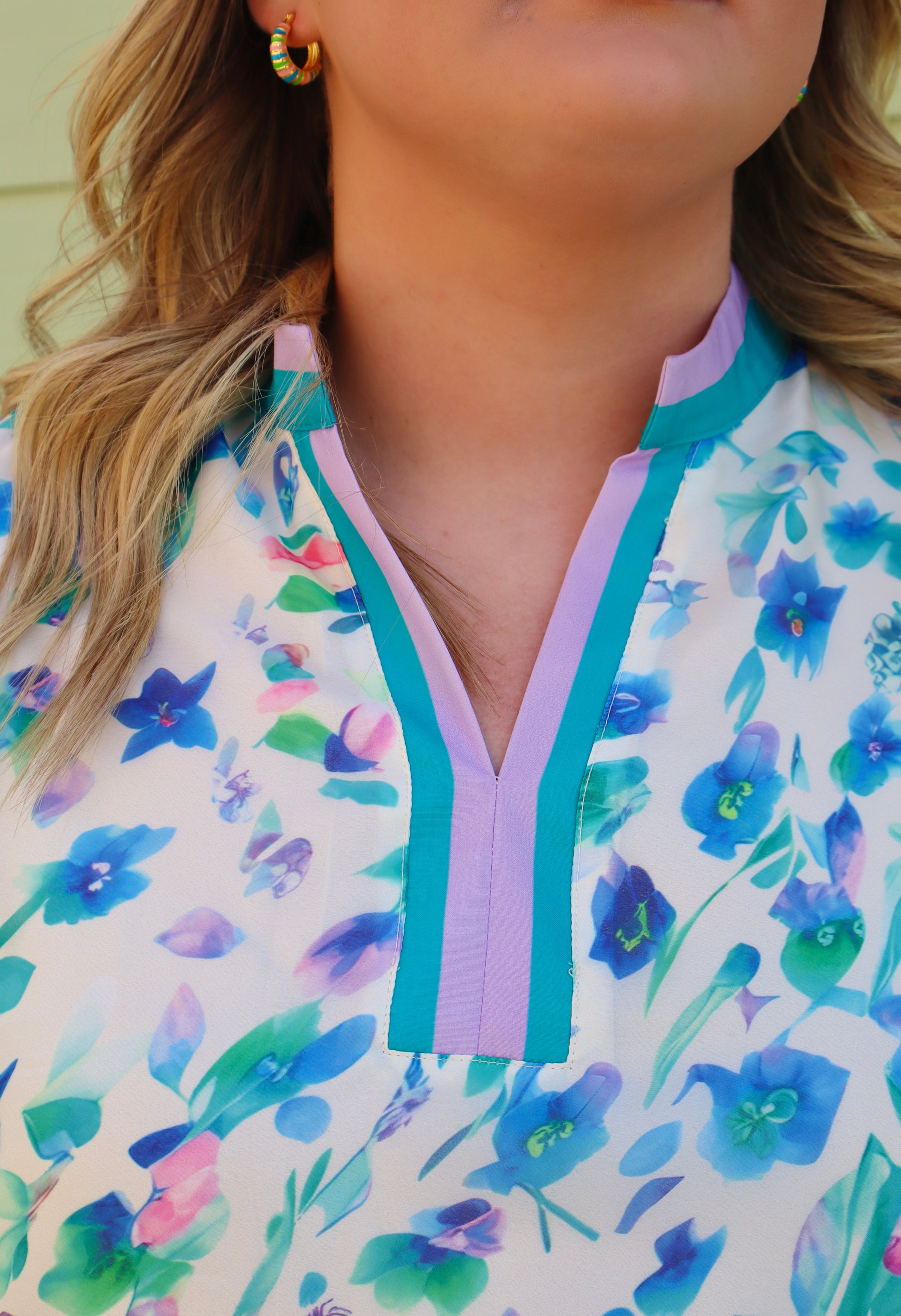 Curvy green floral print colorblock top by Modern Grace, featuring a stylish blend of floral patterns and colorblocking design.