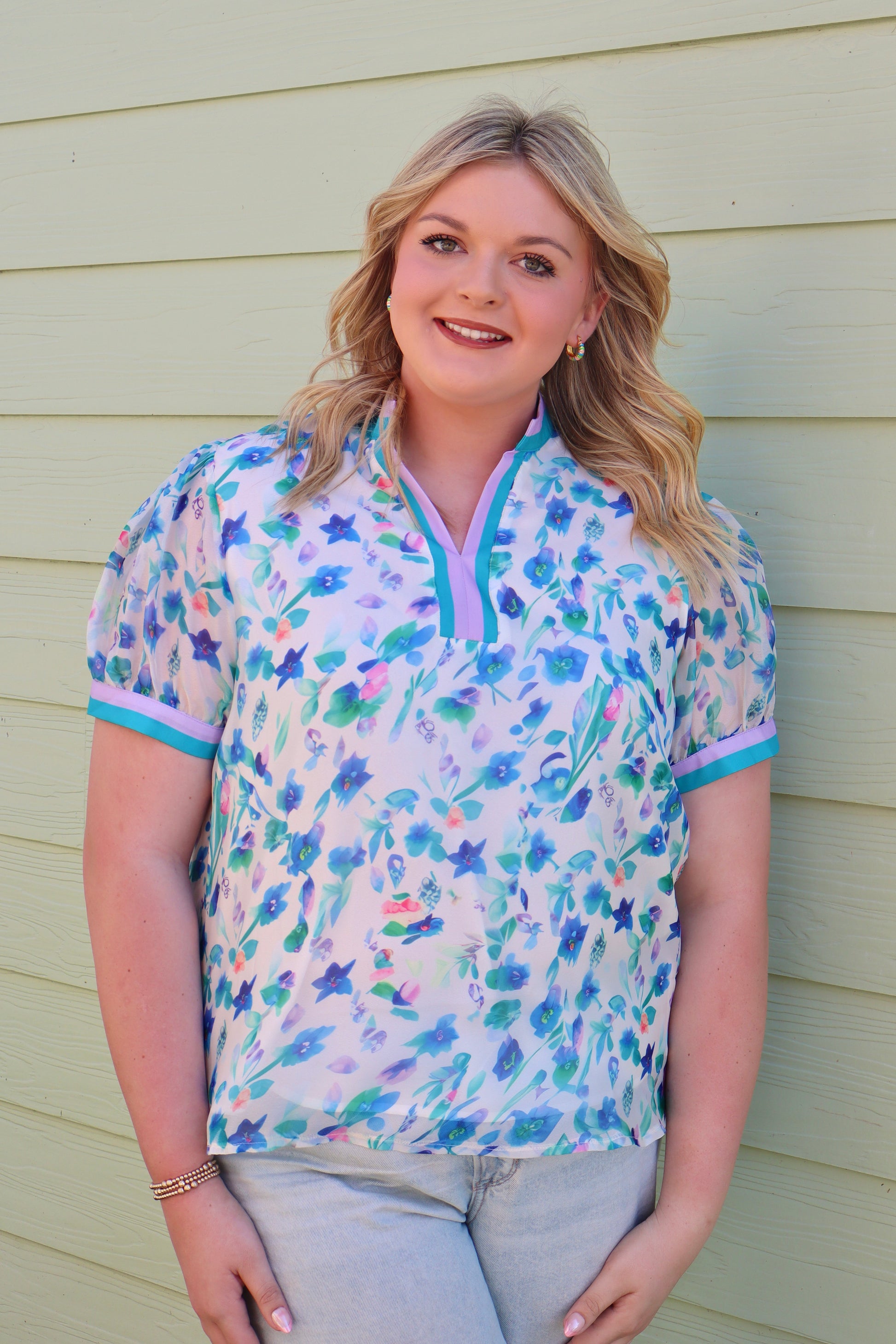 Curvy green floral print colorblock top by Modern Grace featuring a stylish design with vibrant flower patterns and color blocking.