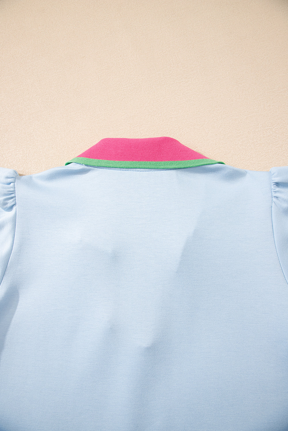 Modern Grace Beau Blue V-neck blouse with contrast ruffled sleeves, collared design, made of polyester, viscose, and elastane fabric.