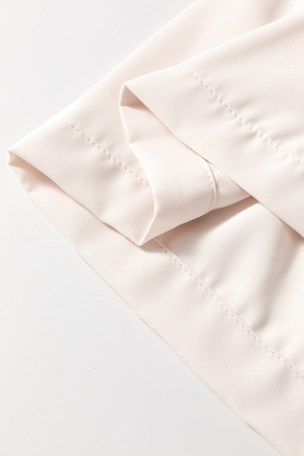 Off White Bow Tie Short Puff Sleeve Blouse by Modern Grace with ruffle hem, lightweight polyester, and elegant design.
