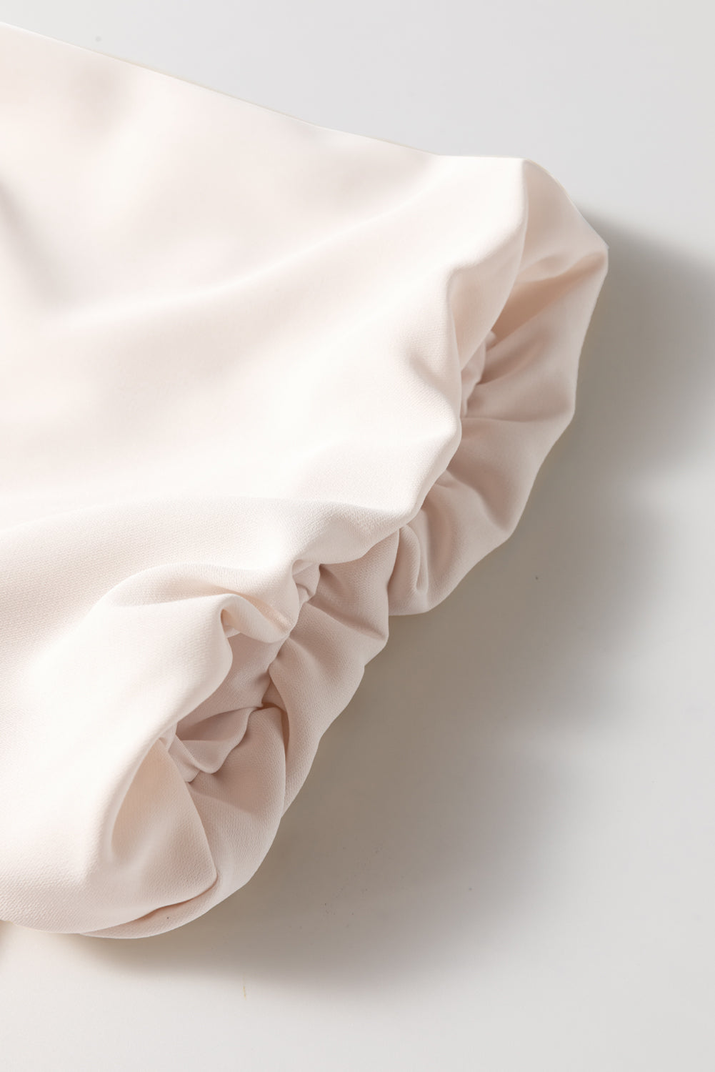 Off White Bow Tie Short Puff Sleeve Ruffle Hem Blouse by Modern Grace, stylish polyester top with bow tie and puff sleeves.