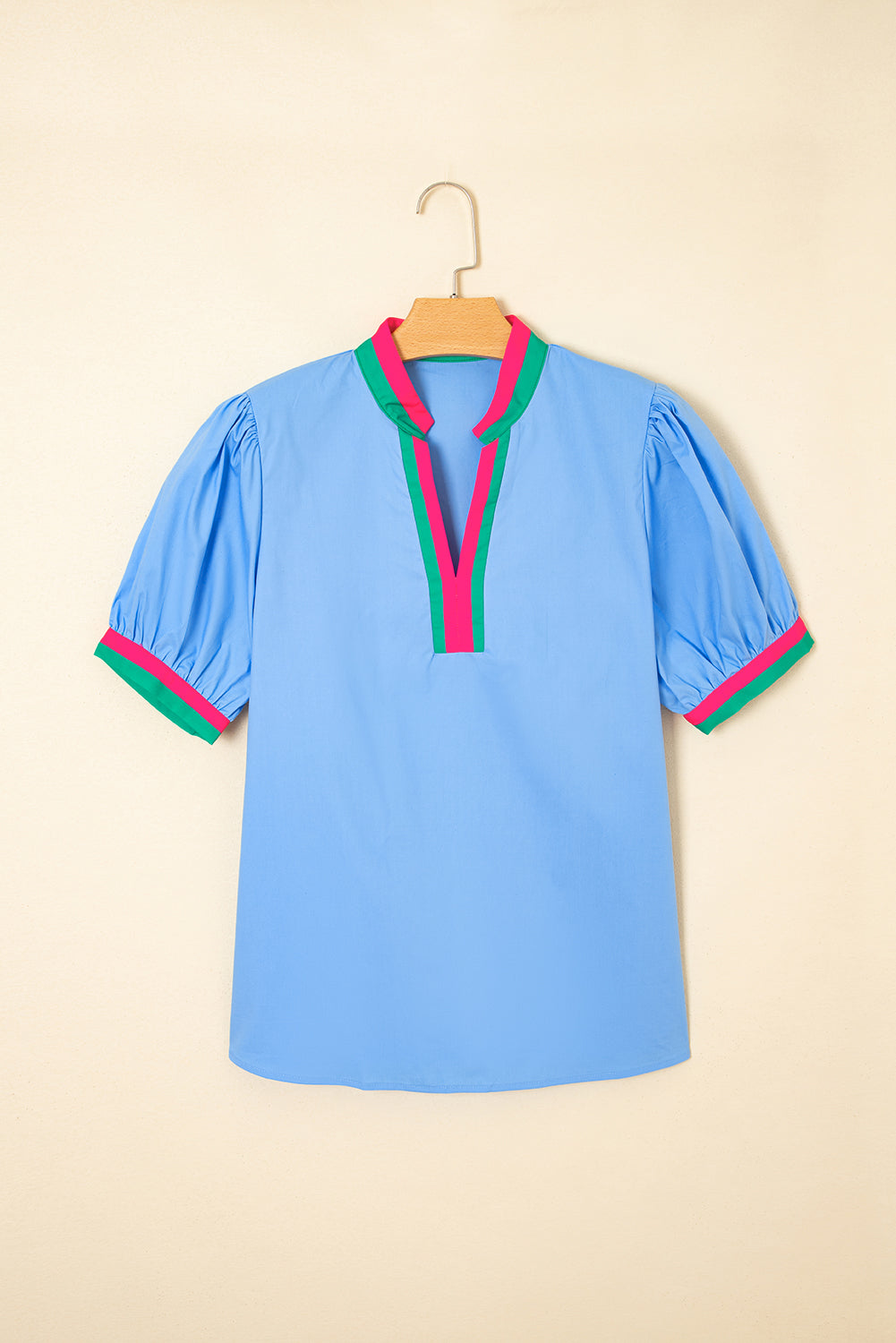 Sky blue striped V-neck blouse with short puff sleeves by Modern Grace, made of 100% cotton, stylish and lightweight for warm weather.