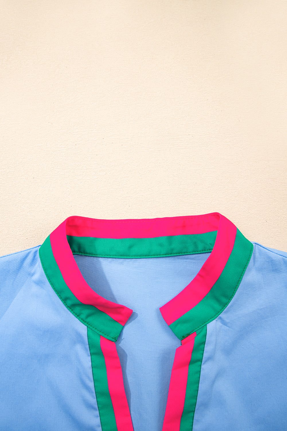 Sky blue striped V-neck blouse with short puff sleeves by Modern Grace, made of 100% cotton, perfect for casual wear.