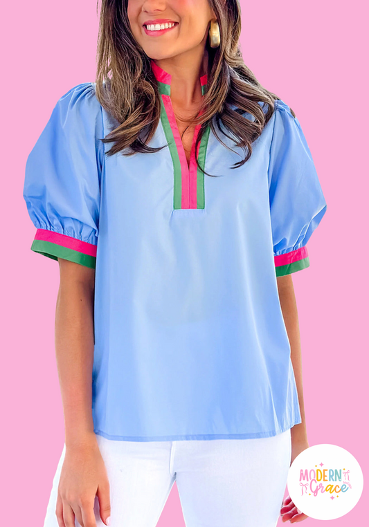 Sky blue striped V-neck blouse by Modern Grace with short puff sleeves, made of 100% cotton, showcasing a stylish casual top.
