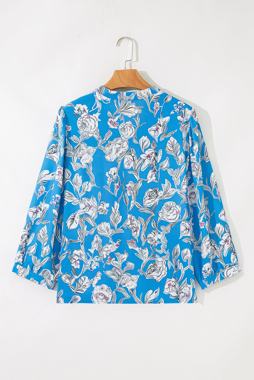 Sky blue floral print blouse with V-neck, 3/4 puff sleeves, by Modern Grace, perfect for casual or dressy occasions.