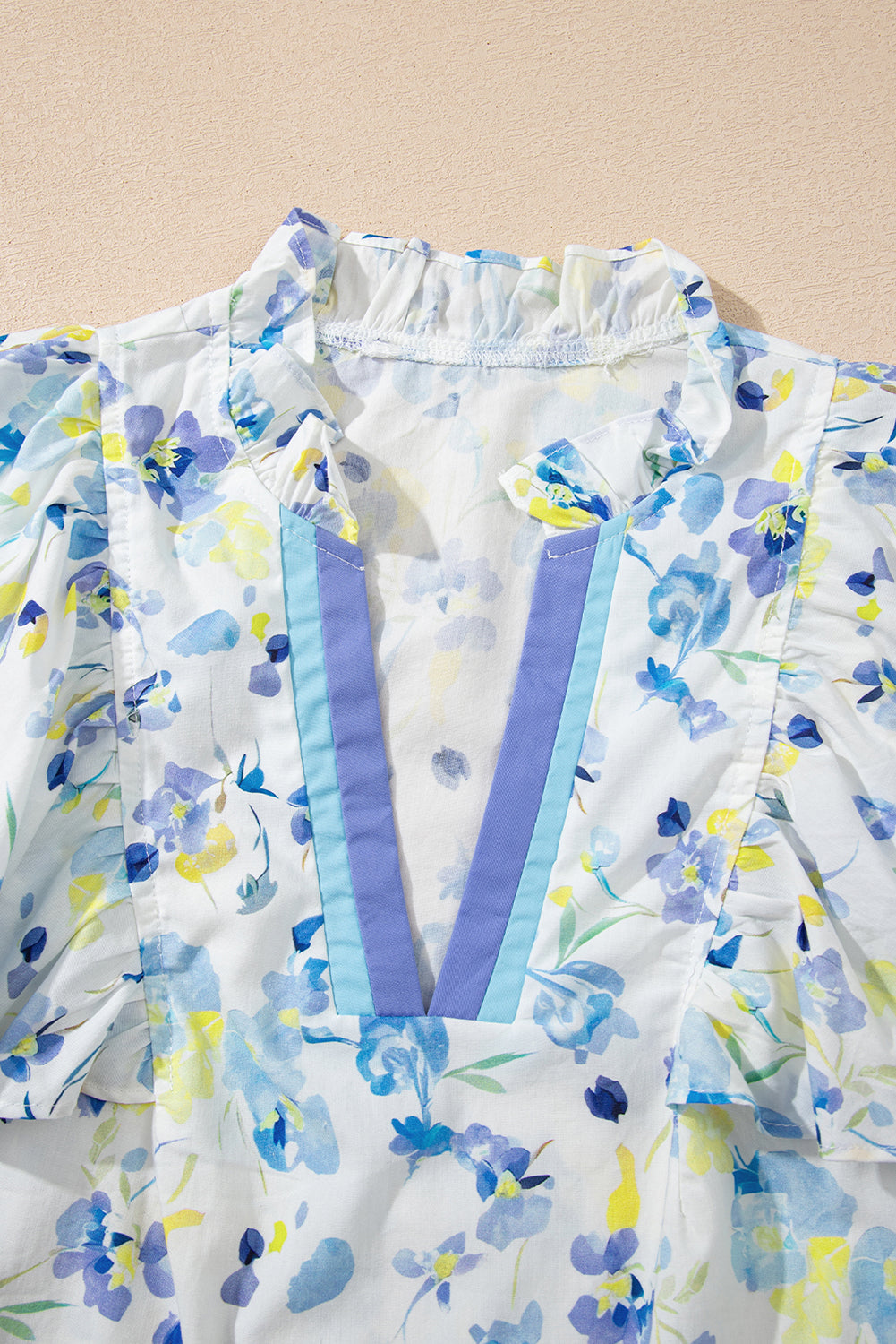 Sky blue floral print blouse by Modern Grace featuring a frilled notched V-neck and lightweight cotton-viscose fabric.