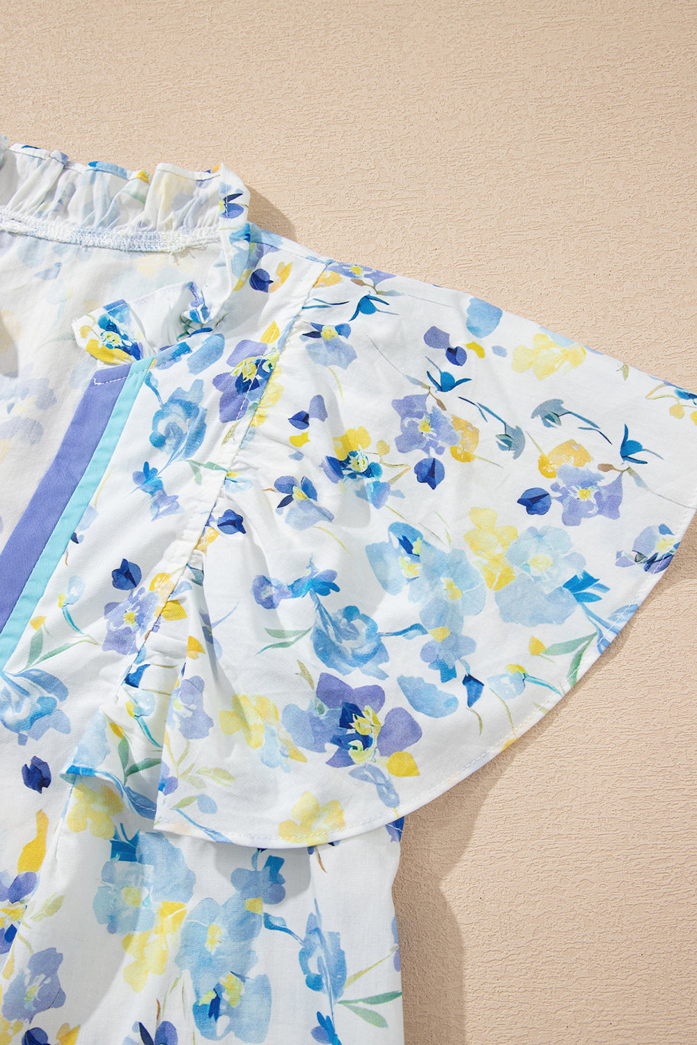 Sky blue floral print blouse by Modern Grace featuring a frilled notched V-neck and lightweight cotton-viscose fabric.