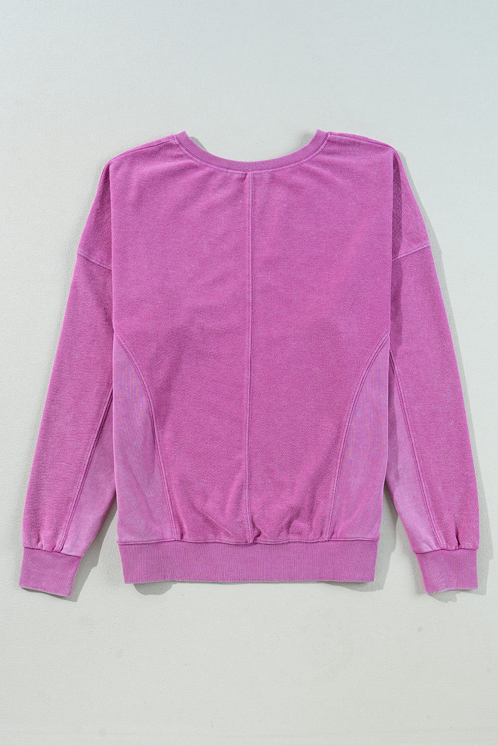 Bright pink solid color notched neck sweatshirt from Modern Grace with drop shoulder design, perfect for casual wear.