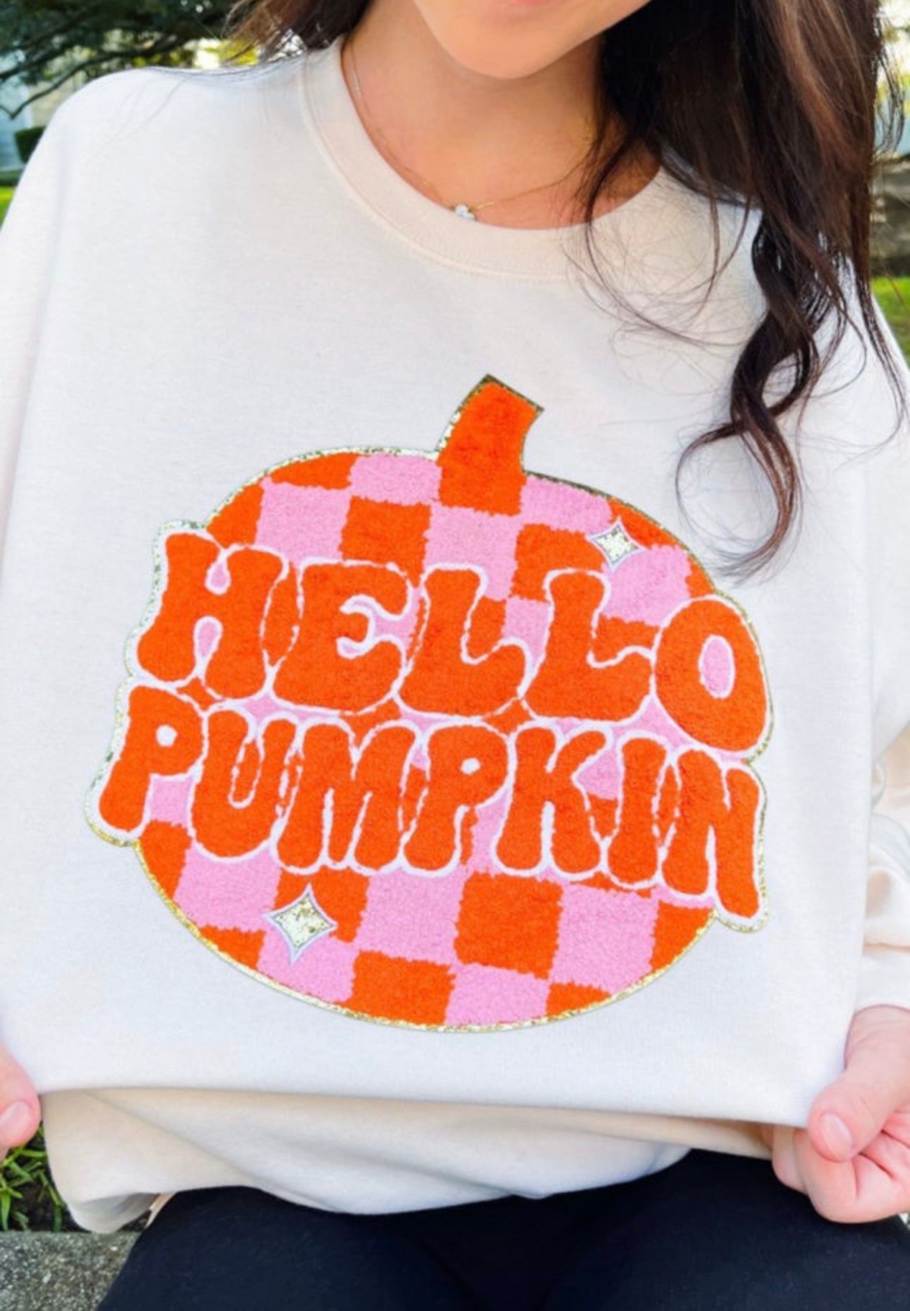 Modern Grace Hello Pumpkin checkered sweatshirt featuring a cozy, stylish design with a classic red and black pattern.
