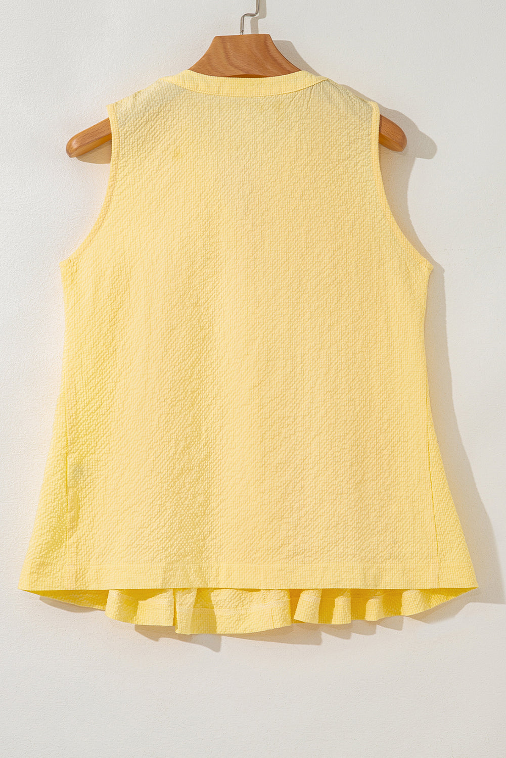 Yellow cream pleated tank top with bow tie and notched neck by Modern Grace, featuring a stylish, lightweight polyester fabric.