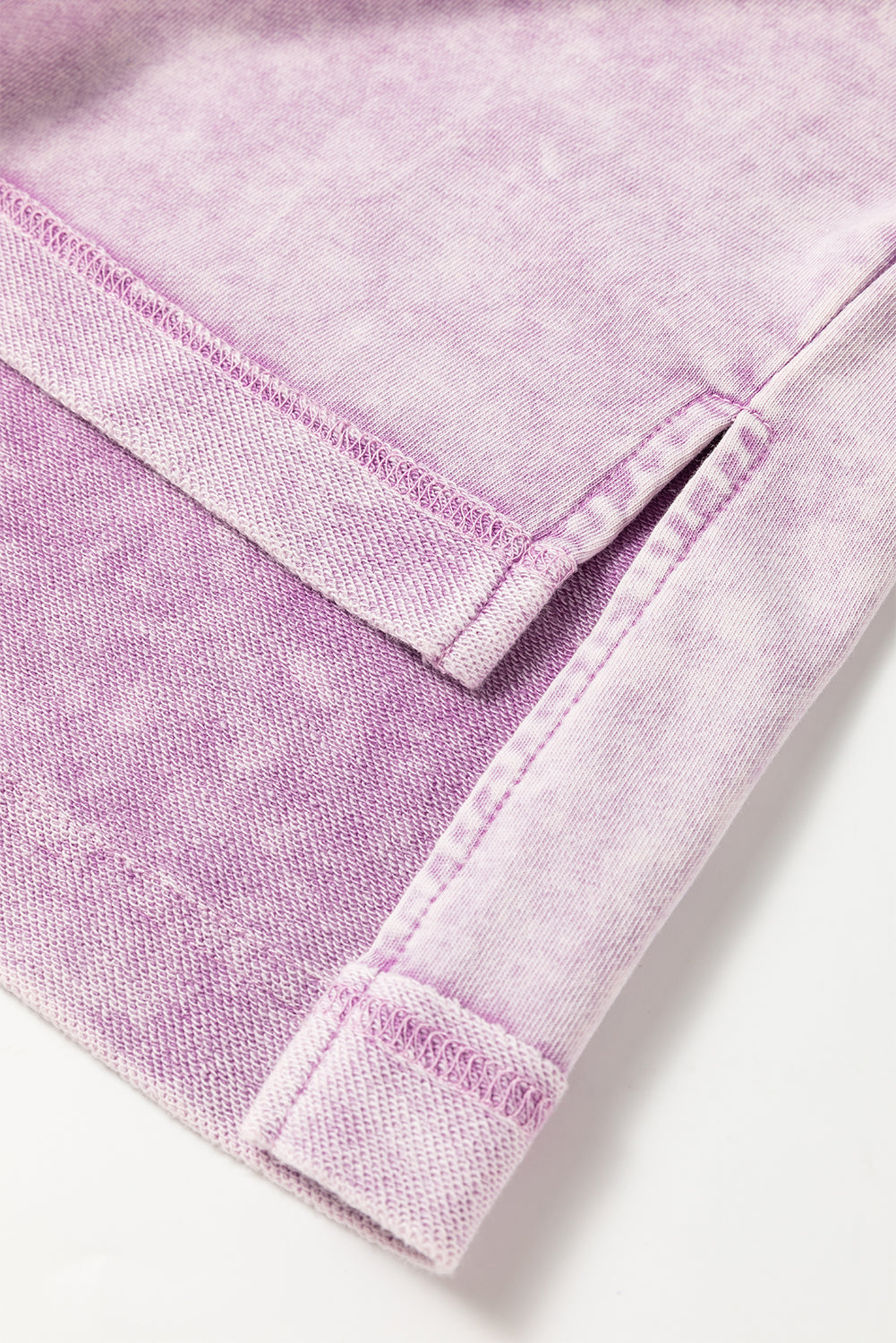 Modern Grace Orchid Petal Mineral Wash oversized drop shoulder tee with exposed seams, relaxed fit, and soft fabric in a light pastel color.