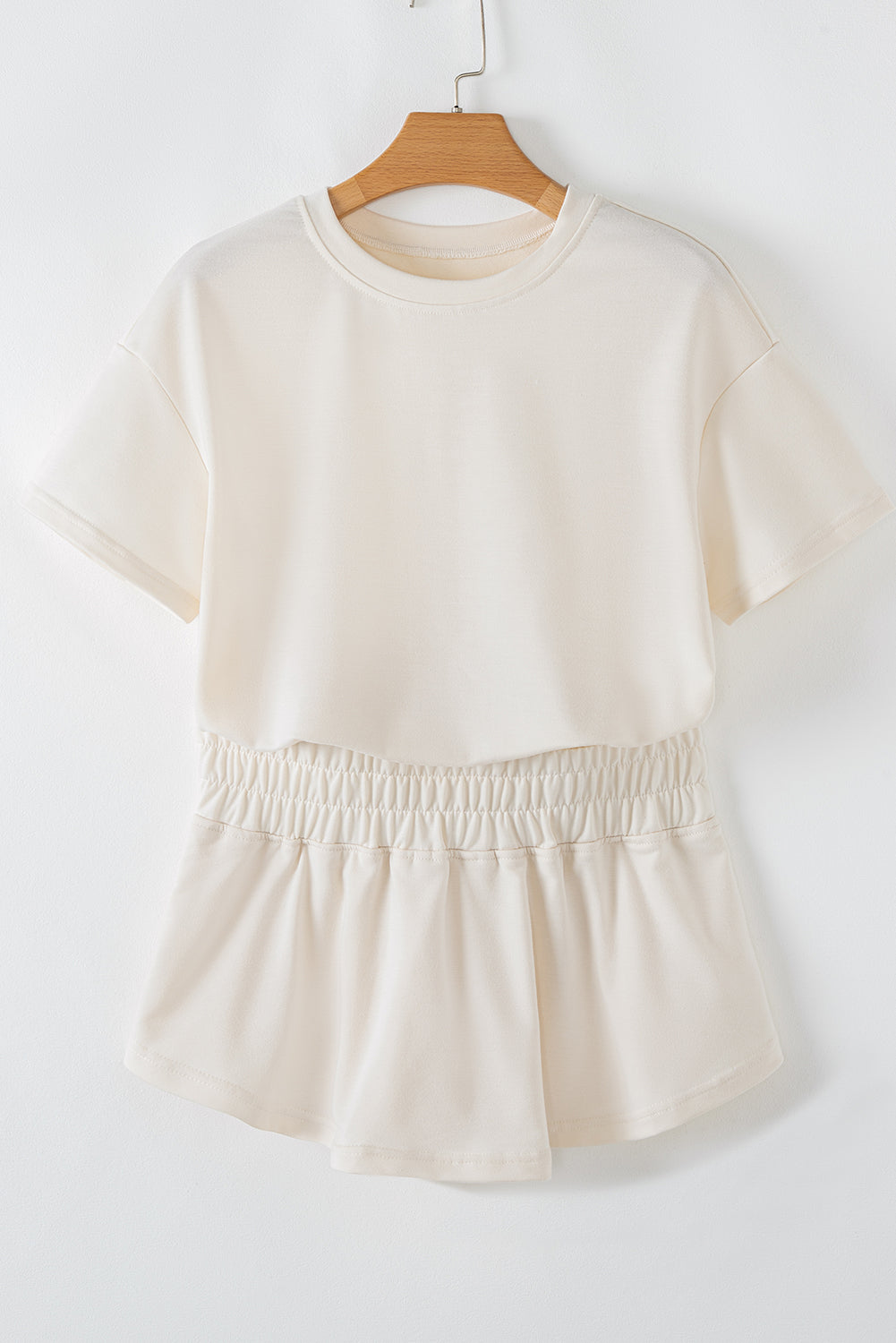 Beige cropped tee and high waist skort set by Modern Grace, stylish two-piece short set with soft fabric for casual wear.