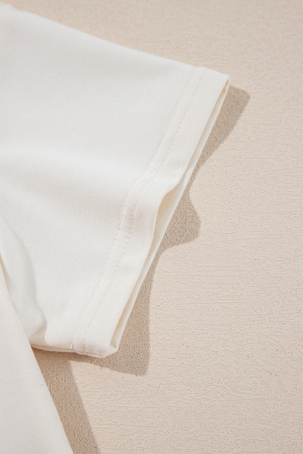 Beige cropped tee and high-waist skort set by Modern Grace, stylish two-piece short set for casual wear, online exclusive.