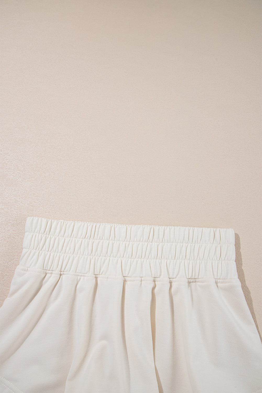 Beige cropped tee and high waist skort set by Modern Grace, casual two-piece short set, lightweight polyester and cotton fabric.