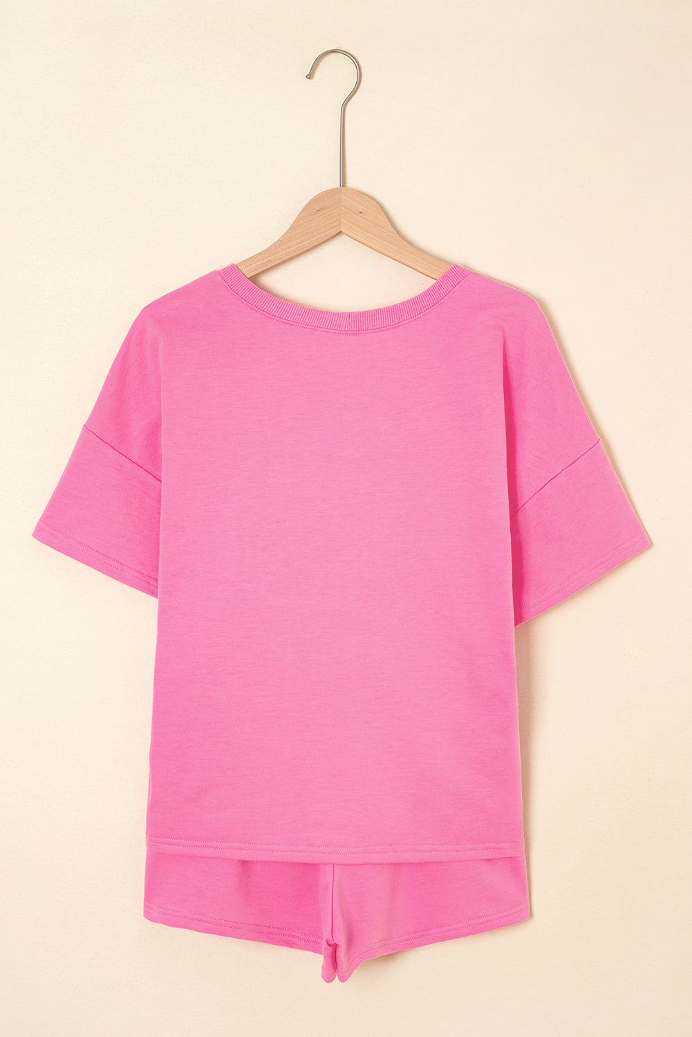 Pink V-neck drawstring shorts set by Modern Grace, two-piece casual outfit with lightweight fabric and relaxed fit.
