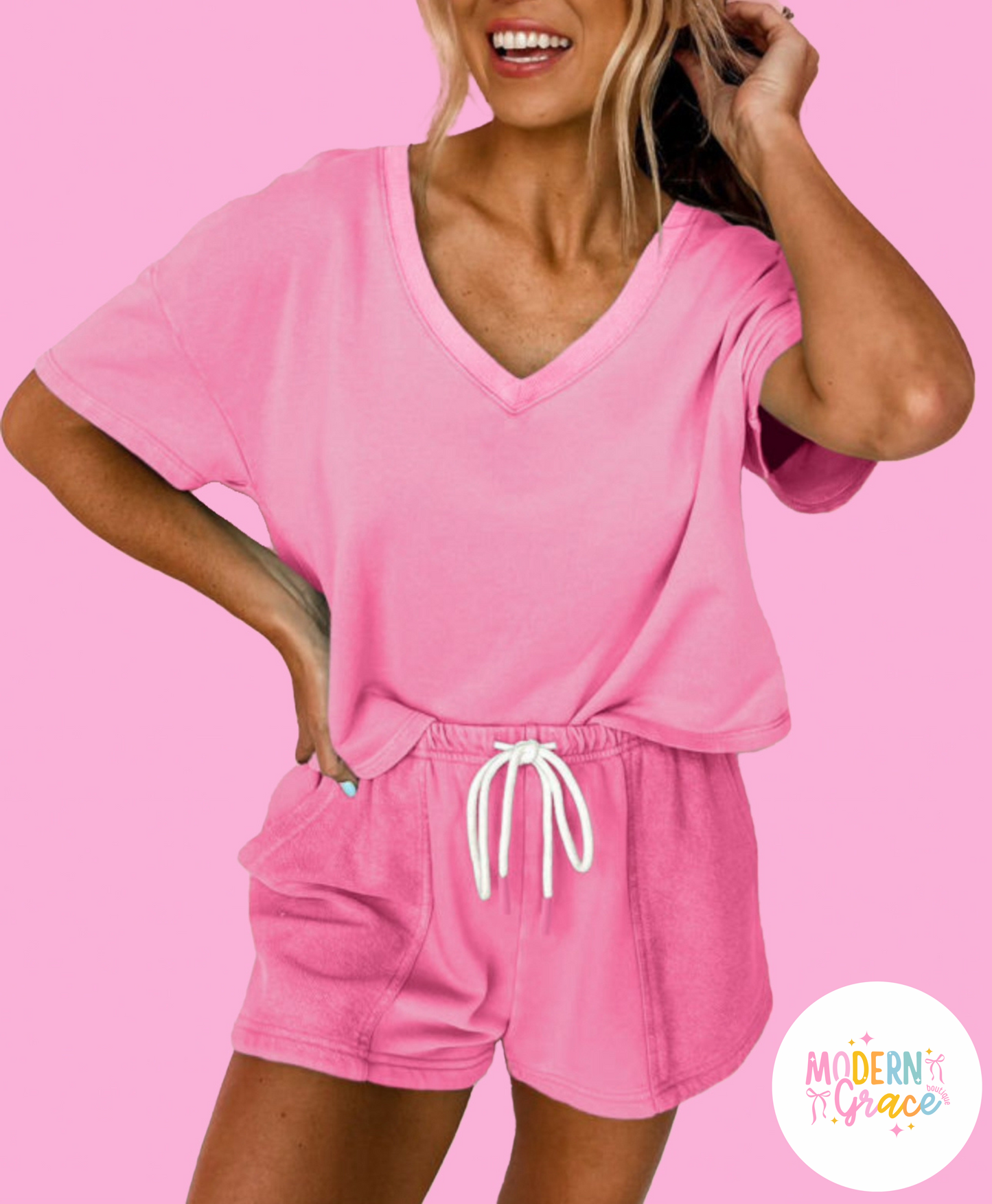 Pink V-neck drawstring shorts set by Modern Grace, two-piece casual outfit with breathable fabric, perfect for relaxed summer wear.
